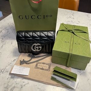 Gucci bag w/receipt. Rare silver hardware. Interior compartments & wallet slots